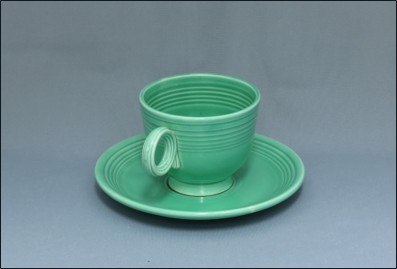 green cup and saucer