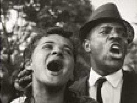 Photo of a man and a woman singing at the March on Washington